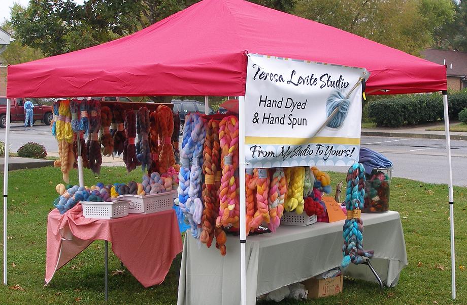 Vendor's booth of hand dyed fiber and yarn