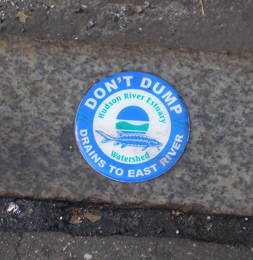 Label on a storm drain about the East River