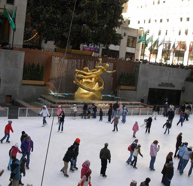 Rockefeller Center Ice Rink, Tree, and Prometheus Fountain Statue.