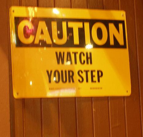 A blurry watch your step sign