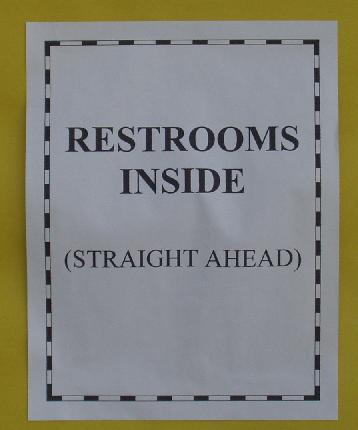 restroom sign on the school door