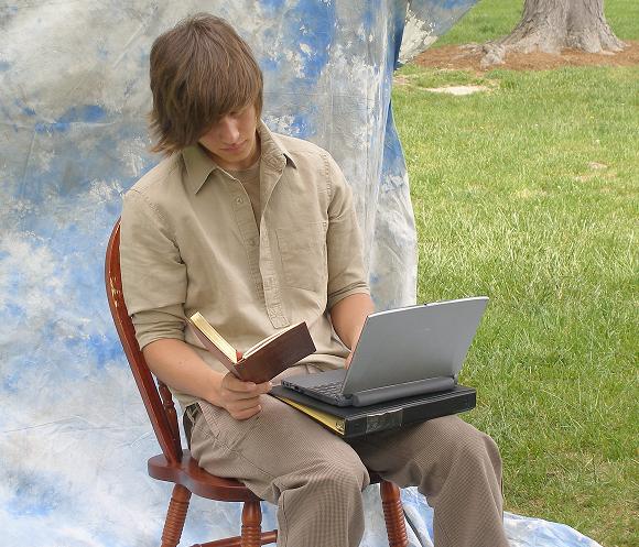 Lawrence with book and laptop.
