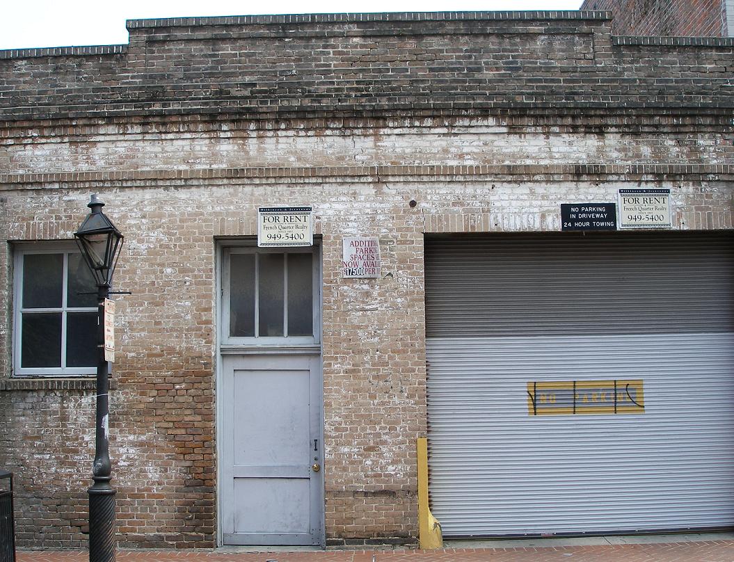 several signs on closed garage