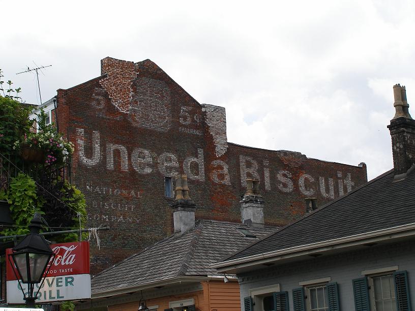 Aging sign overlooking Bourbon Street